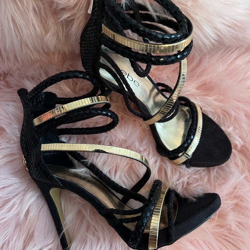 Bebe Black and Gold Strappy Sandal